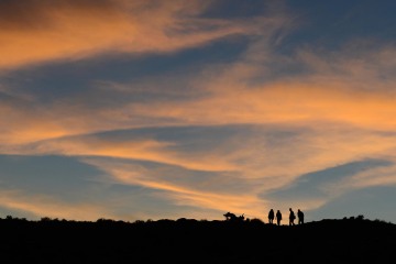 Hikers at Sunset || Arches NP